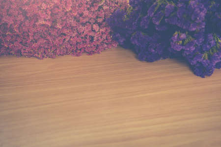 Vintage flower on wooden tableの写真素材