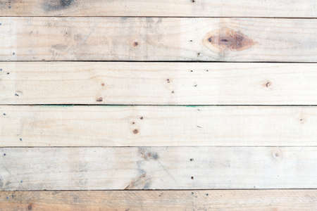 Grunge brown wood  wall background with knots and nail holesの写真素材