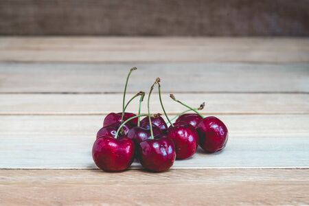 Sweet fresh cherry on woodenの写真素材