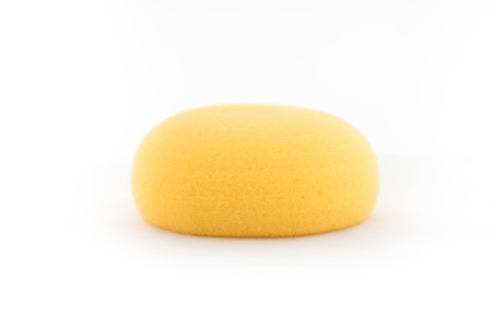 Yellow sponge for baby on white backgroundの写真素材