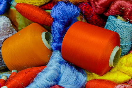 Silk Production Process, Silkworm cocoons.Colorful raw silk thread  in country of asiaの写真素材