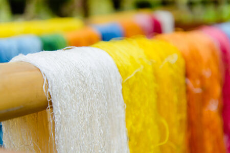 Silk Production Process, Silkworm cocoons.Colorful raw silk thread  in country of asiaの写真素材