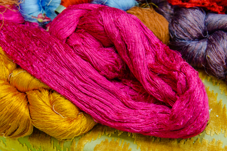 Silk Production Process, Silkworm cocoons.Colorful raw silk thread  in country of asiaの写真素材
