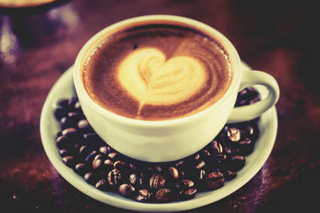Mocha coffee with hot milk in coffee, beautiful makeup.の写真素材