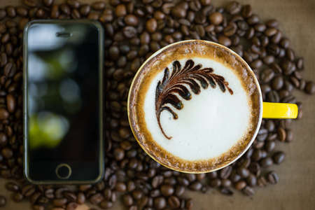 Mocha coffee with hot milk in coffee, beautiful makeup.の写真素材