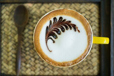 Mocha coffee with hot milk in coffee, beautiful makeup.の写真素材