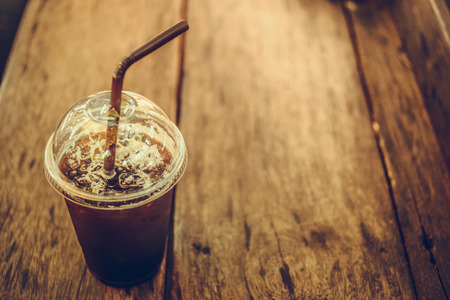 Black coffee without sugar into a glass of cold plastic.の写真素材