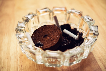 Ashtray cigarette from coffee grounds  Brewing coffee grounds through it.の写真素材
