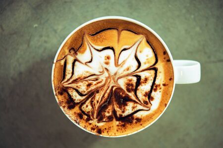 coffee mocha hot  on wooden table on brown backgroundの写真素材