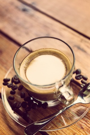 Hot coffee, mocha brown wood table top.の写真素材