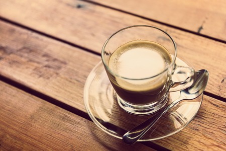 Hot coffee, mocha brown wood table top.の写真素材