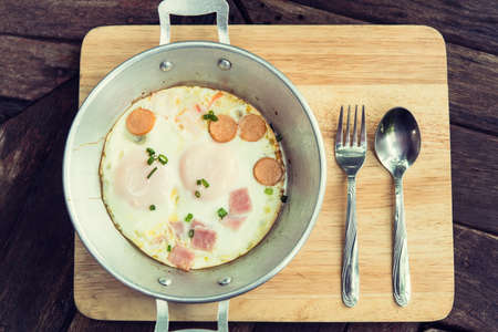 Breakfast egg dish served with fried egg delicious.の写真素材