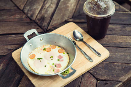 Breakfast egg dish served with fried egg delicious.の写真素材