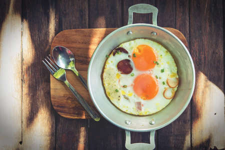 Breakfast egg dish served with fried egg delicious.の写真素材