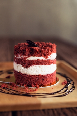 Cake cherry on the  appetizing Wooden brown background.