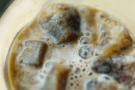 Ice  coffee and Coffee and syrup on a wooden table in a coffee shop.の写真素材