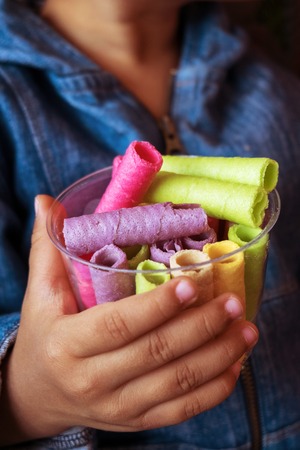 asia Children eating  Tootsie Dessert colorfulの写真素材