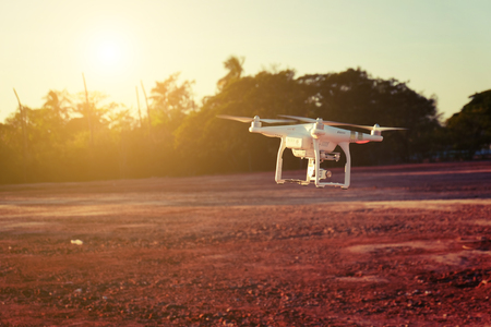 Drone flying in the sunset light beautiful and drone white colorの写真素材
