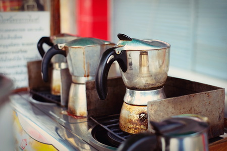 moka pot Italian traditional coffee maker with hot coffee,making coffee in moka potの写真素材