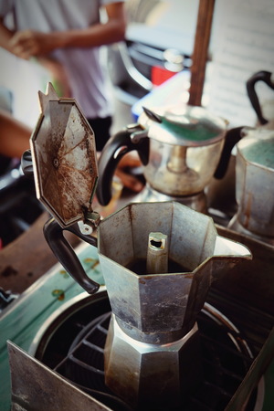 moka pot Italian traditional coffee maker with hot coffee,making coffee in moka potの写真素材