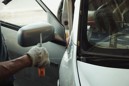 Repair and install auto glass,the broken windshield in car accident,の写真素材