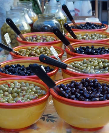 Black and green olives in a provential market    の写真素材
