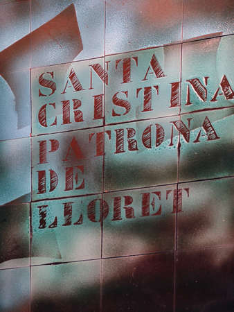 Santa cristina patrona text on a wall of the Church in Lloret de Marの写真素材