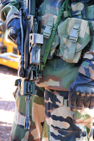 Close up of a soldier with a gun の写真素材