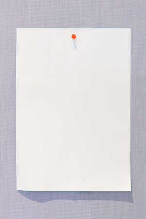 Paper on board with orange pin