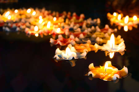 Flower candle floating on a waterの写真素材
