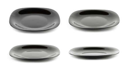 Set of empty black plates isolated on white background with different angle of view の写真素材