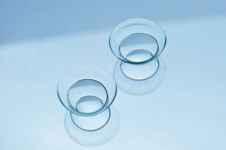 Contact lenses on blue backgroundの写真素材