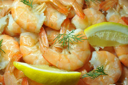 Boiled shrimps with lemon and dill. の写真素材