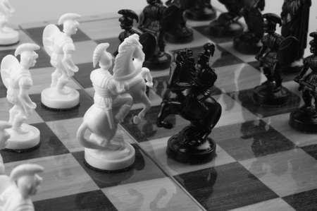 A Chess game on the chess board. Black and white photo.の写真素材