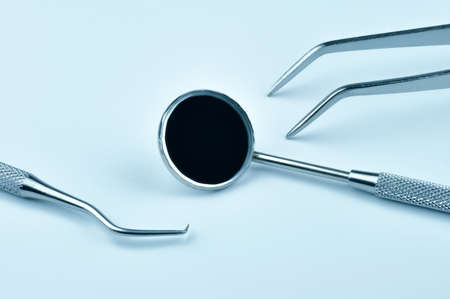 Dental tools on a blue background.の写真素材