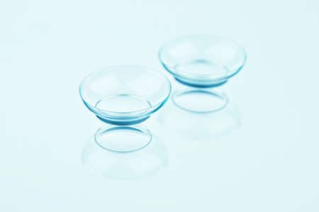 Contact lenses on a light background. Perfectly retouched contact lenses on a light blue background.
