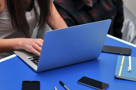 Programmer, Mobile Application Designers, Web Designer working at office. Teamwork and programming websites and mobile applications on the laptop.の写真素材