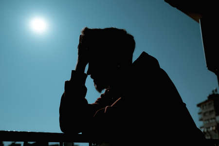 Depression, thoughtful young man can't deal with his problems, the adult who has a hard time overcoming sadness has a confusion of thoughtsの写真素材