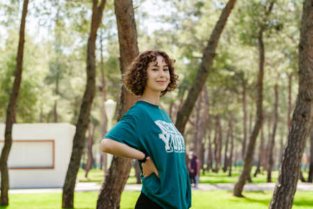 Redhead serious woman standing on city park, outdoors crossed hands show no stop forbidden symbol, rejection expression crossing arms.の写真素材