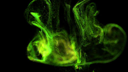 stream of green luminous particles underwater on black background runs into a spherical field, place...