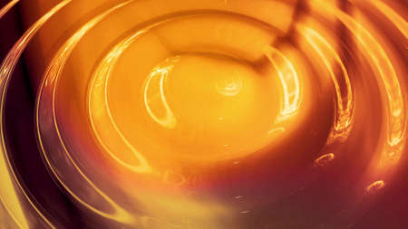 Abstract background with wavy sparkling golden liquid pattern on shiny glossy surface. Viscous yellow fluid like surface of gold foil or brilliant glass. Beautiful creative festive backdrop. 3d renderの写真素材