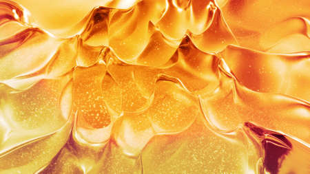 Abstract background with wavy sparkling golden liquid pattern on shiny glossy surface. Viscous...