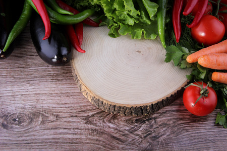 fresh organic vegetables on a cutting board, healthy diet conceptの写真素材