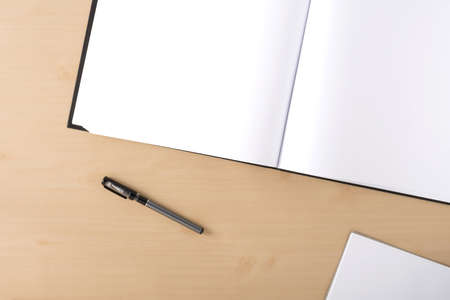 White blank artbook on the table with penの写真素材
