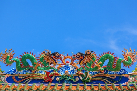 Dragon sculpture on roof of temple in Thailandの写真素材