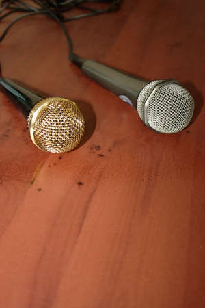 two mikes on brown colour tableの写真素材