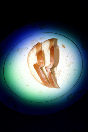abstract scene two slices bread on varicoloured backgroundの写真素材