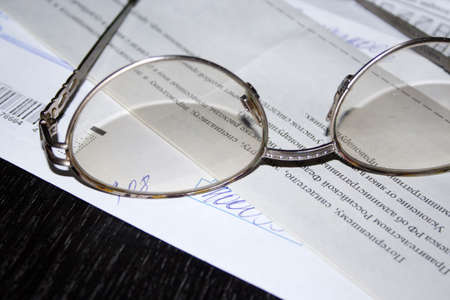 spectacles and letter with markの写真素材