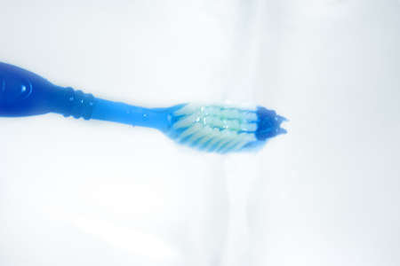 water results from faucet and toothbrush with hygenic paste for peelings teethの写真素材