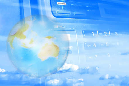 globe on background of the keyboard of the telephone